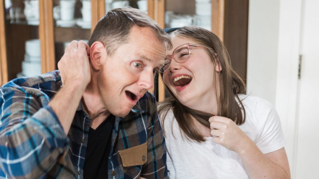 Dr. Aaron Hartman laughing with his 19-year-old daughter, Anna.